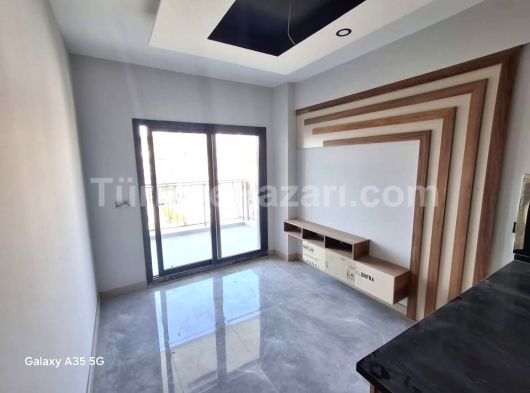 KUŞADASI EGE MAHALLESİNDE SİTE İÇİNDE SATILIK 1+1 SIFIR DAİRE DENİZ MANZARALI