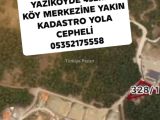 SAFRANBOLU YAZIKÖYDE  KÖY MERKEZİNE ÇOK KADASTRO YOLA CEPHELİ ULAŞIM KOLAY ETRAFINDA YAPILAŞMA VAR