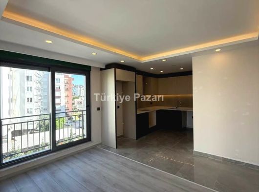 ANTALYA KEPEZ GÖÇERLER MAHALLESİN DE SATILIK YERDEN ISITMALI 2+1 ABD MUTFAK DAİRELER
